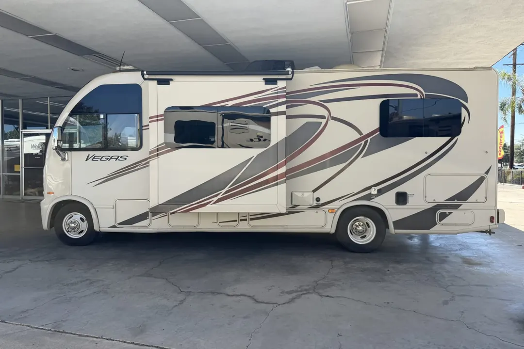 Side view of a 2015 Thor Vegas motorhome