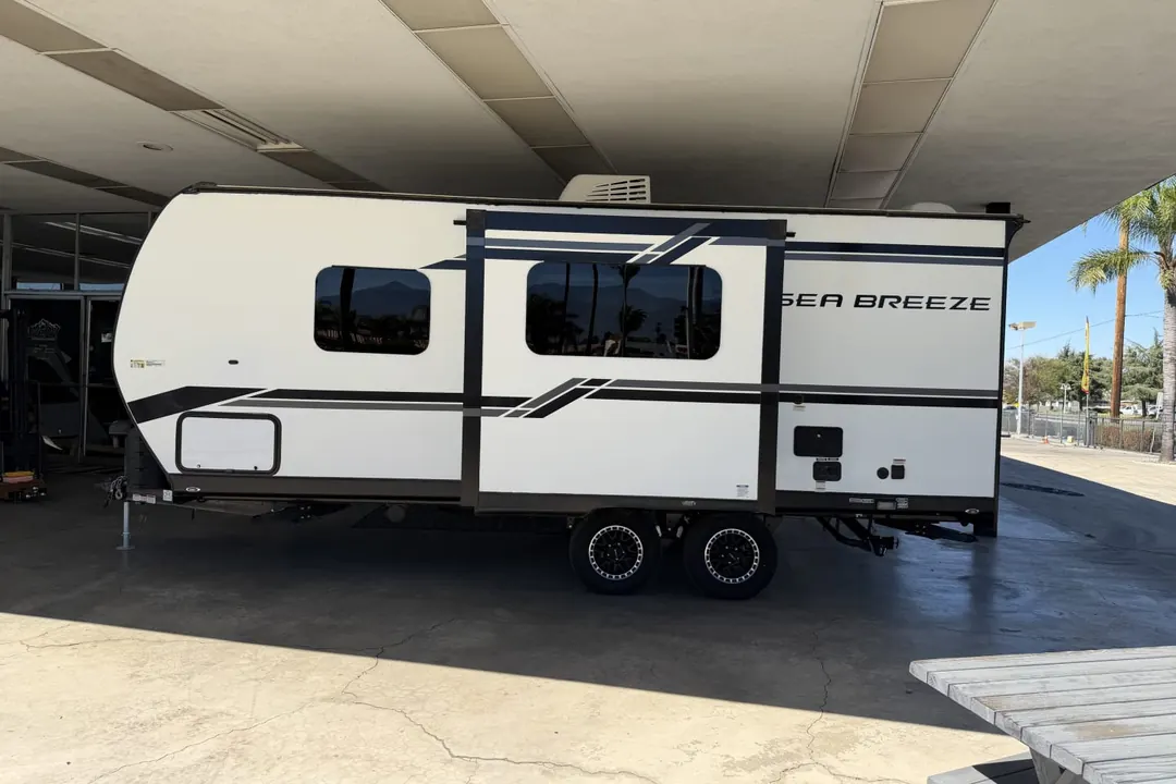 Side view of a 2023 Genesis Supreme Sea Breeze travel trailer