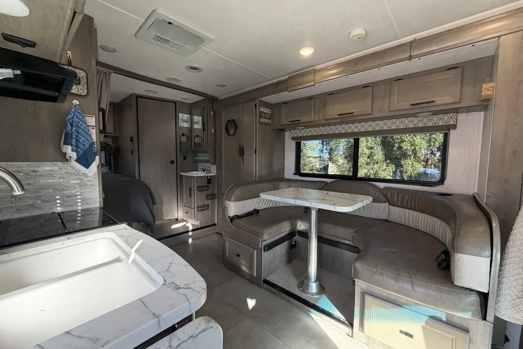 The dinette and galley inside a 2020 Coachmen Prism