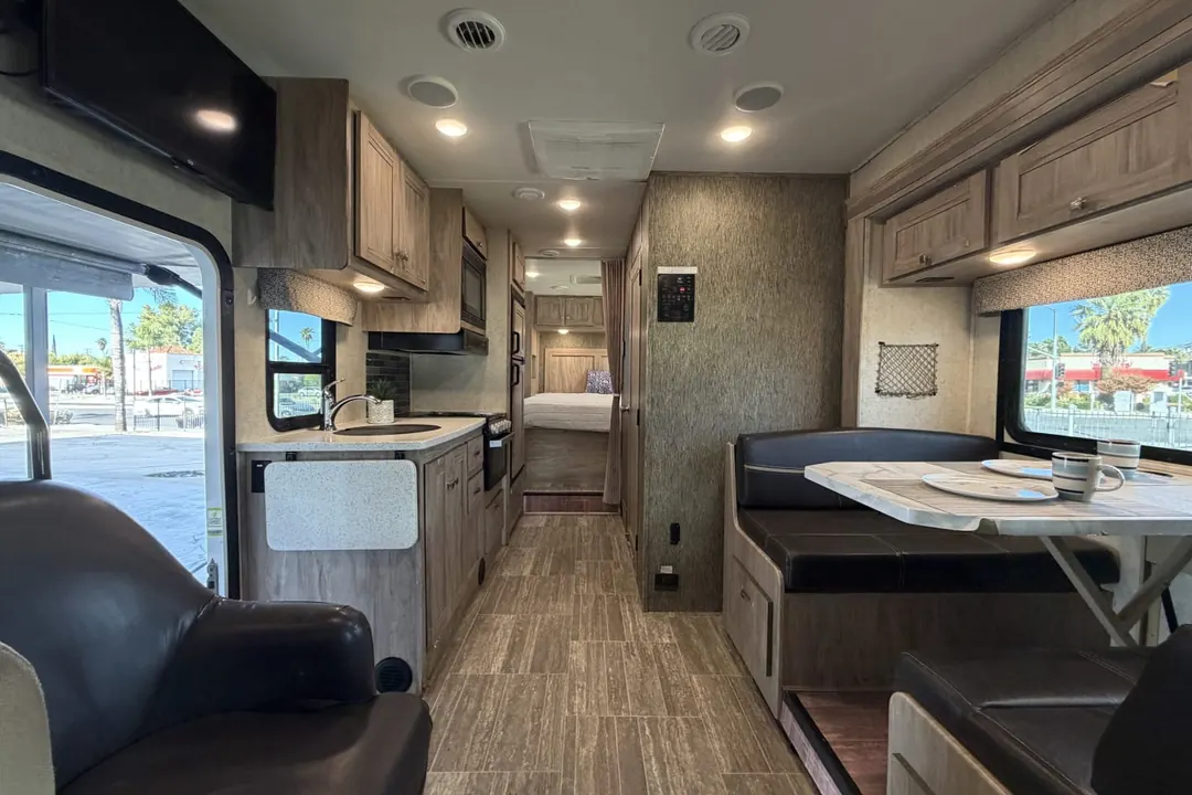 The living area and kitchen inside a 2019 Forest River Sunseeker