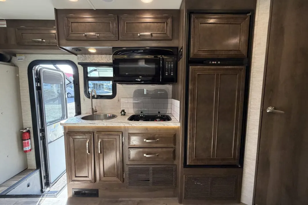 The entry door, galley and cabinets in a 2021 Jayco Melbourne