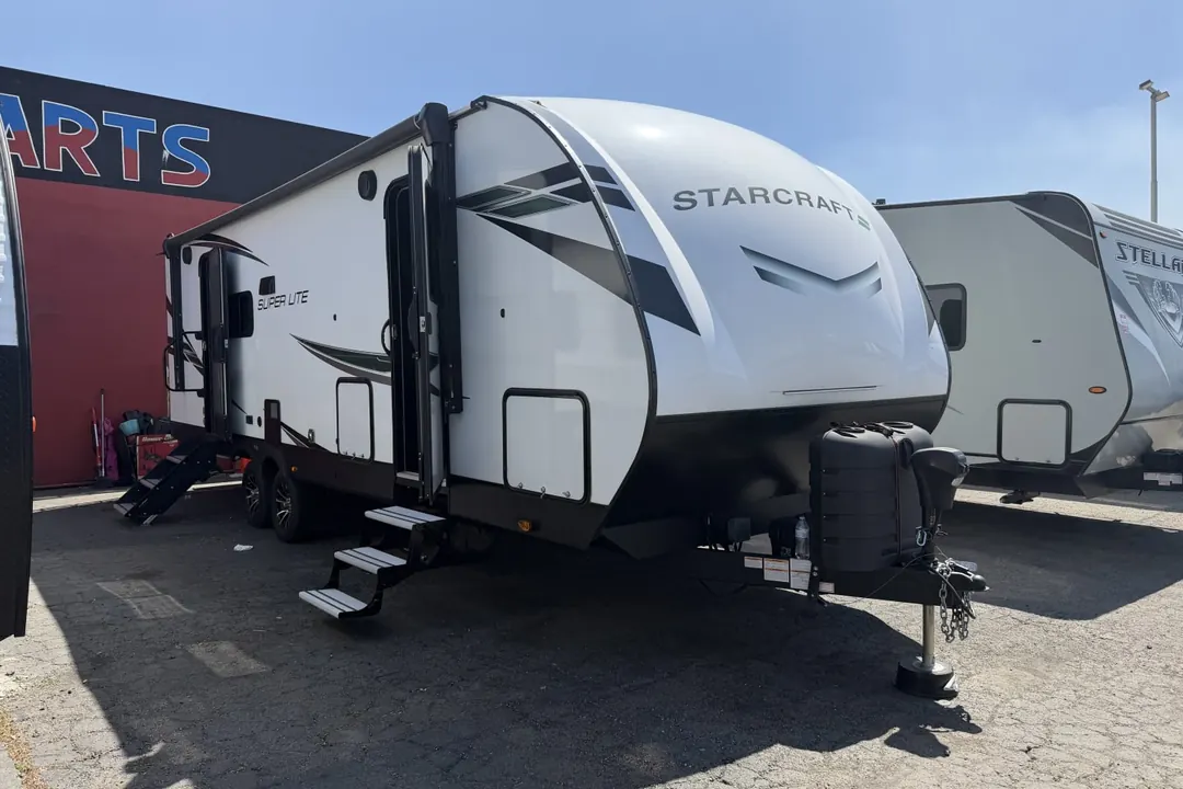 A 2024 Starcraft Super Lite travel trailer with its steps down