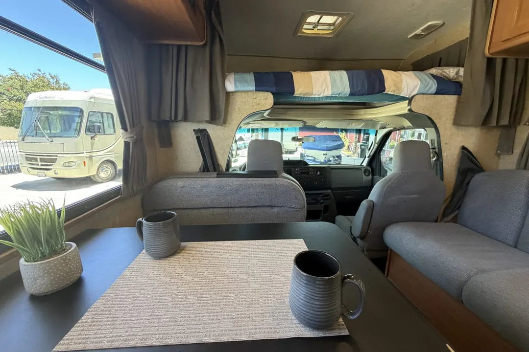 Coffee mugs set out on the dinette table of a 2016 Forest River Majestic