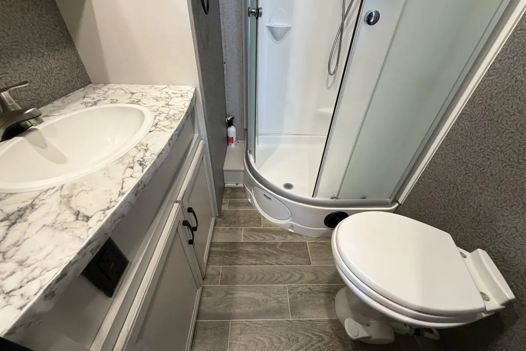 The sink, shower and toilet in a 2021 Jayco Jay Feather