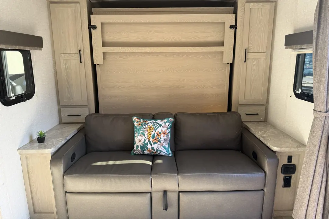 The sofa and lounge inside a 2021 Forest River Rockwood Mini Lite